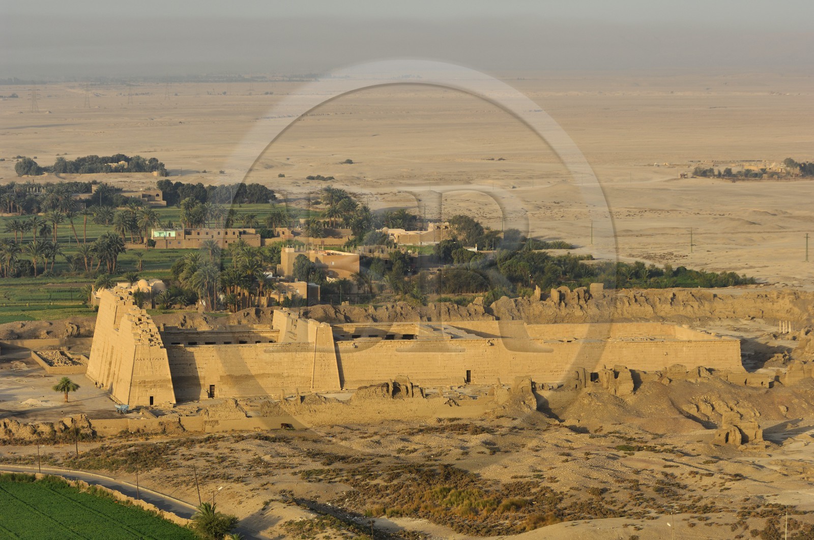 Egypt, Upper Egypt, Nile Valley, surroundings of Luxor, West bank, Thebes Necropolis listed as World Heritage by UNESCO,  Medinet Habu, Ramesses III Temple (aerial view)