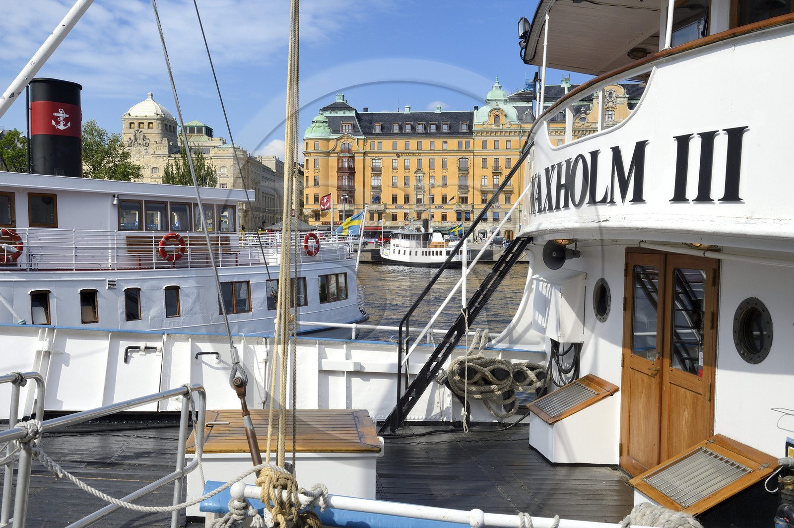 Sweden, Stockholm, Norrmalm city center district, ferries moored at the Nybrokajen quay