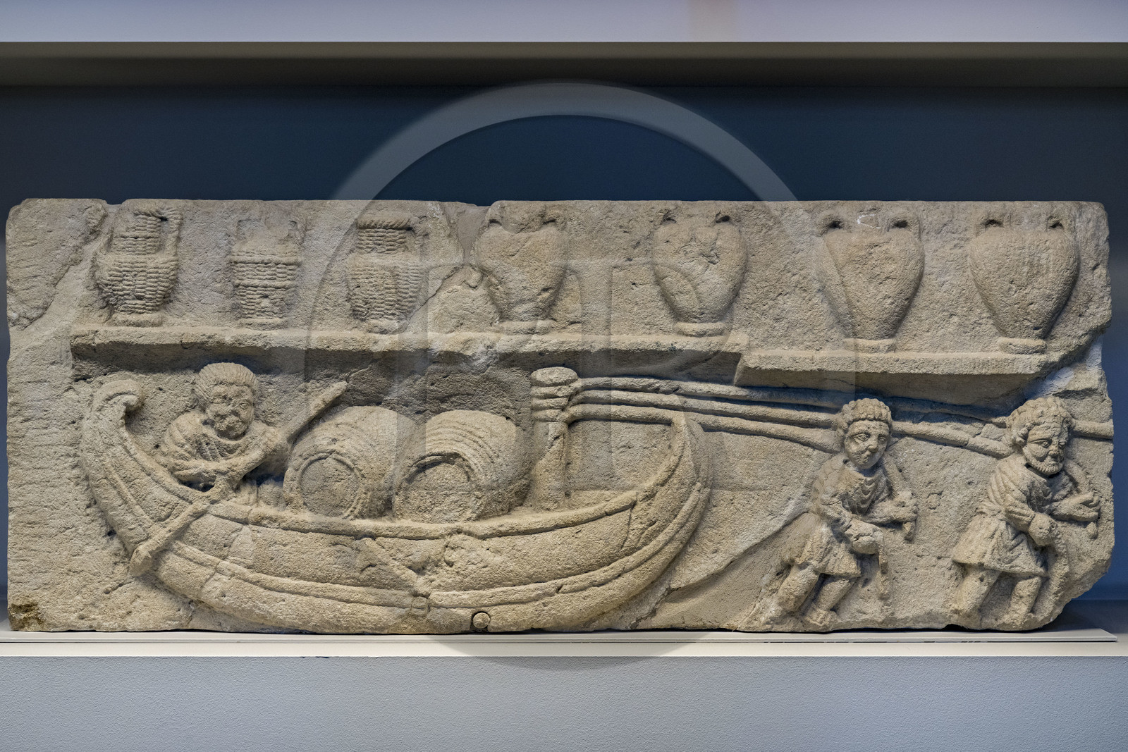 France, Vaucluse, Avignon, Lapidary Museum installed in a former chapel of the Jesuit college, archaeological collections of the Calvet Museum, fragment of a relief called La Scene de Halage, two haulers pull a boat loaded with barrels (Gallic invention) piloted by a man at the helm, detail of the mausoleum of a rich wine producer probably towards the Durance, Gallo-Roman work from the 2nd-3rd century