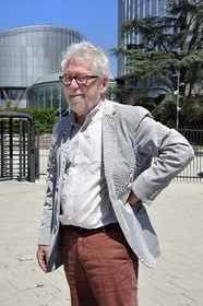 France, Bas Rhin, Strasbourg, European district, the architect Claude Bucher in front of the building of the European Court of Human Rights that he designed with the architect Richard Rogers
