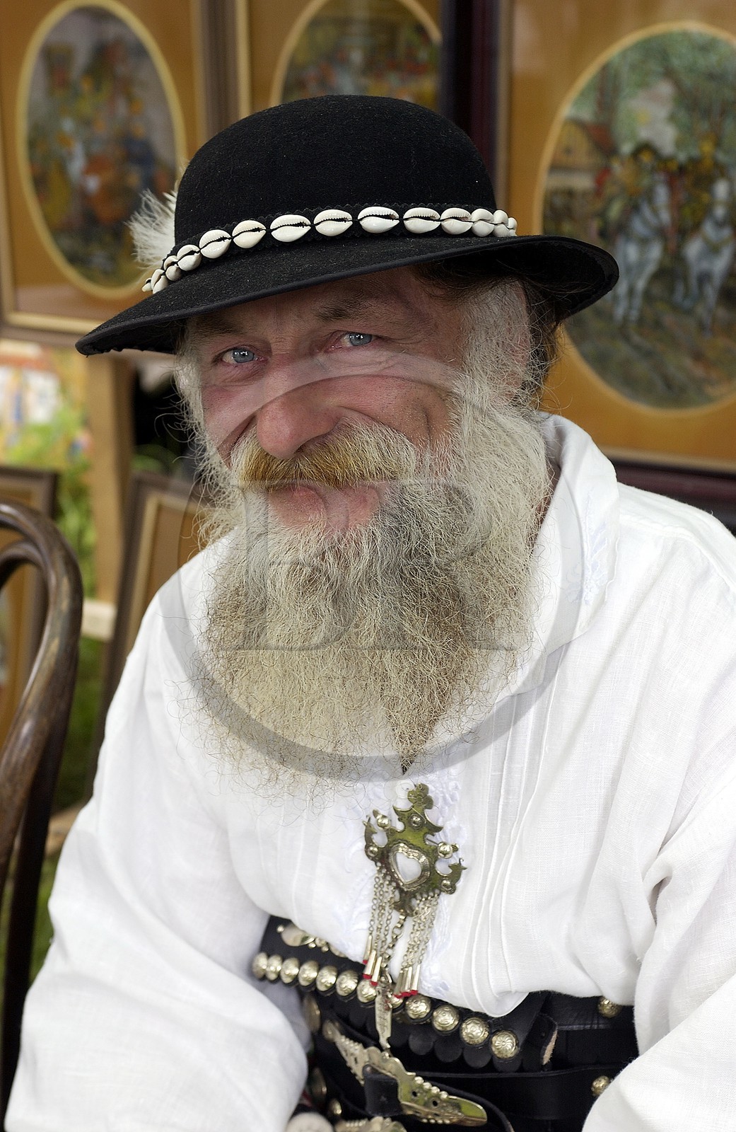 Poland, Lesser Poland, Carpathian Mountains, craftsman wearing traditional costume of his region