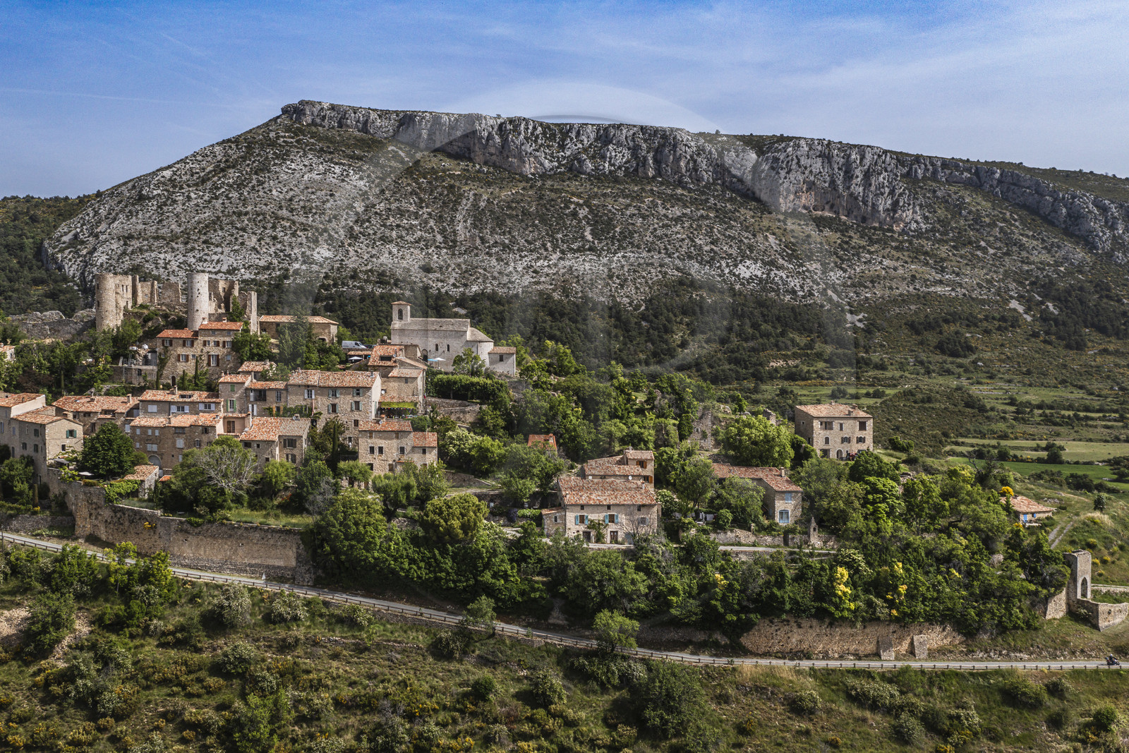 France, Var, Verdon Regional Natural Park, Bargeme village, labelled Les Plus Beaux Villages de France (The Most Beautiful Villages of France), and the Sabran de Ponteves castle and the Montagne de Brouis in the background (aerial view)
