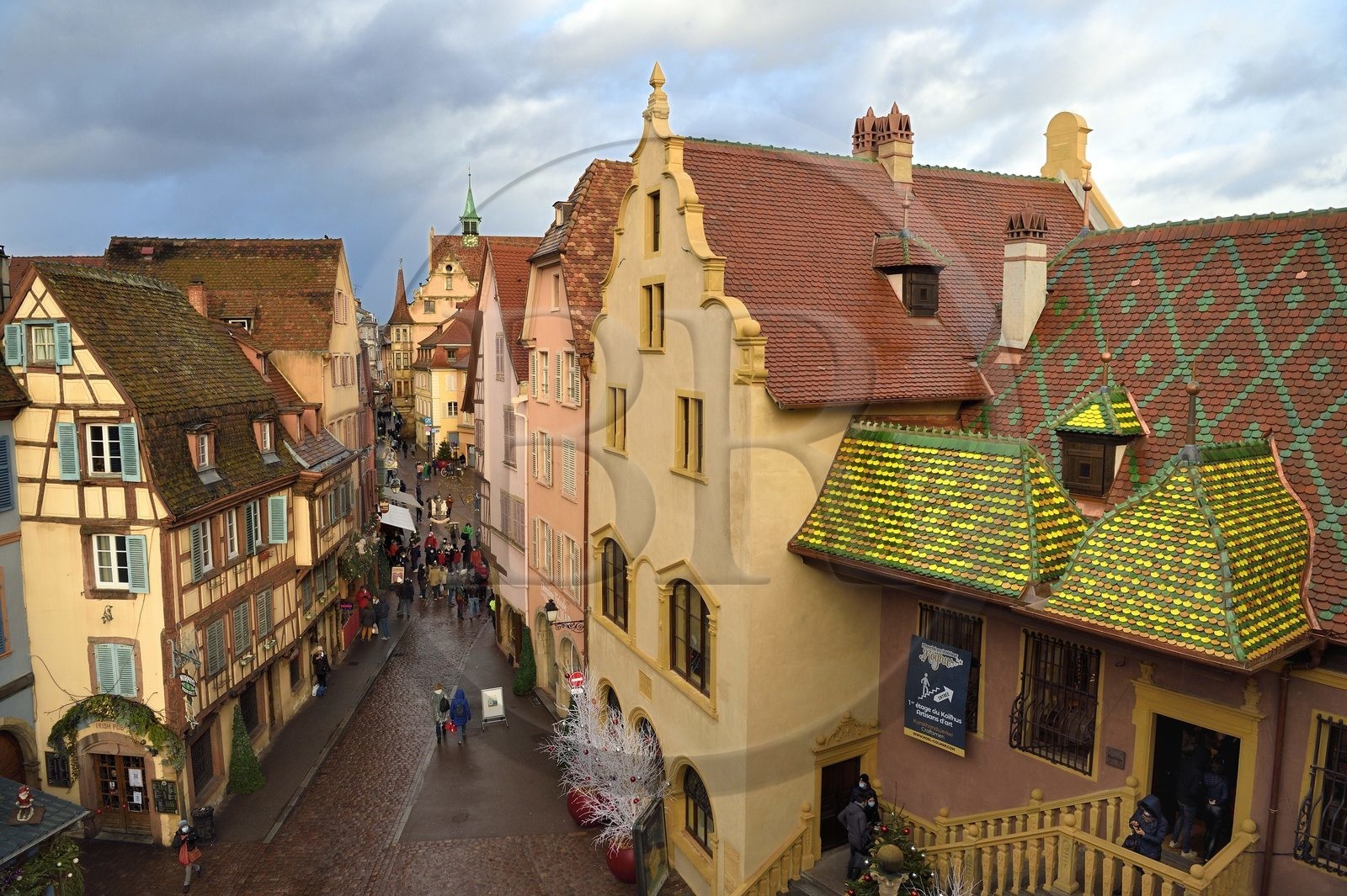France, Haut Rhin, Colmar, gabled houses and wood-framed houses in Grand Rue with Christmas decorations, on the right the former douane or customs control edifice (Koifhus)