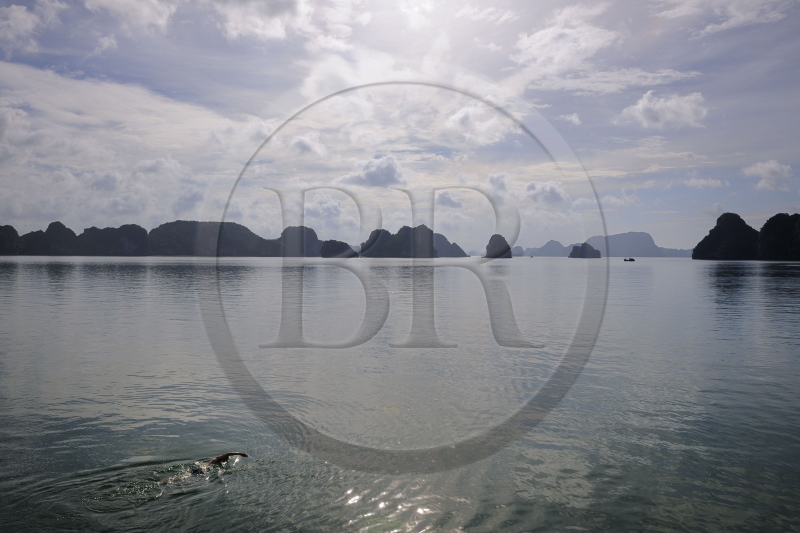 Vietnam, Quang Ninh Province, swimmer in Halong Bay, listed as World Heritage by UNESCO