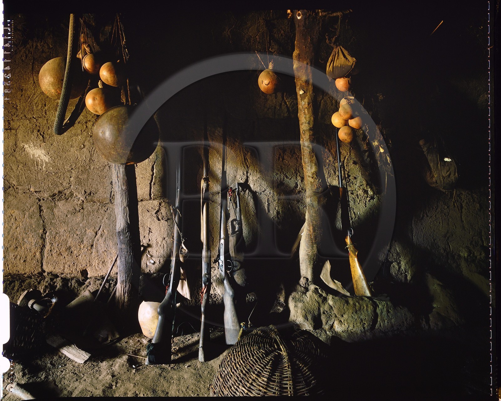 Burkina Faso, Poni province, Lobi land, Loropéni region, Lacar, house entrance with powder guns, each family Lobi has a small arsenal always ready to serve to face a possible attack of the house or the village
