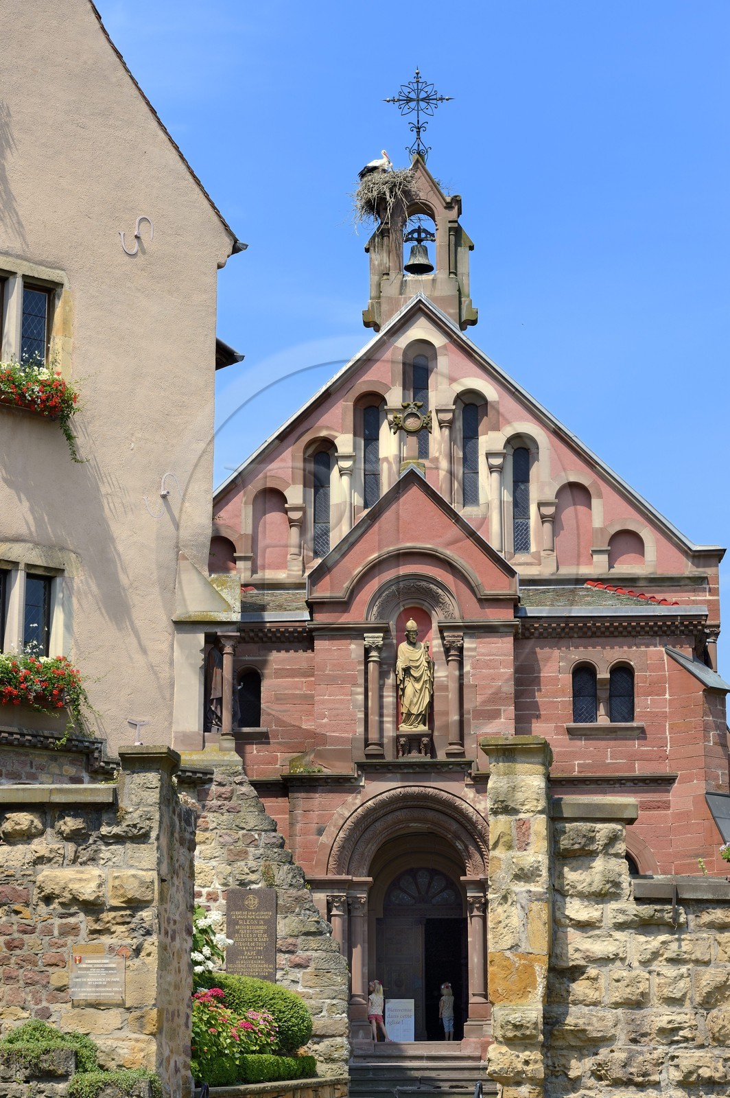 France, Haut Rhin, Eguisheim, labelled Les Plus Beaux Villages de France (The Most Beautiful Villages of France), stork nest on top of the chapel of Leo IX