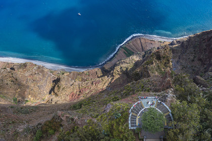 Portugal, Madeira Island, Camara de Lobos, the Cap Girao belvedere, a glass platform overlooking the second highest cliff in the world at 589 meters high, cultivated fields at the foot of the cliff (aerial view)