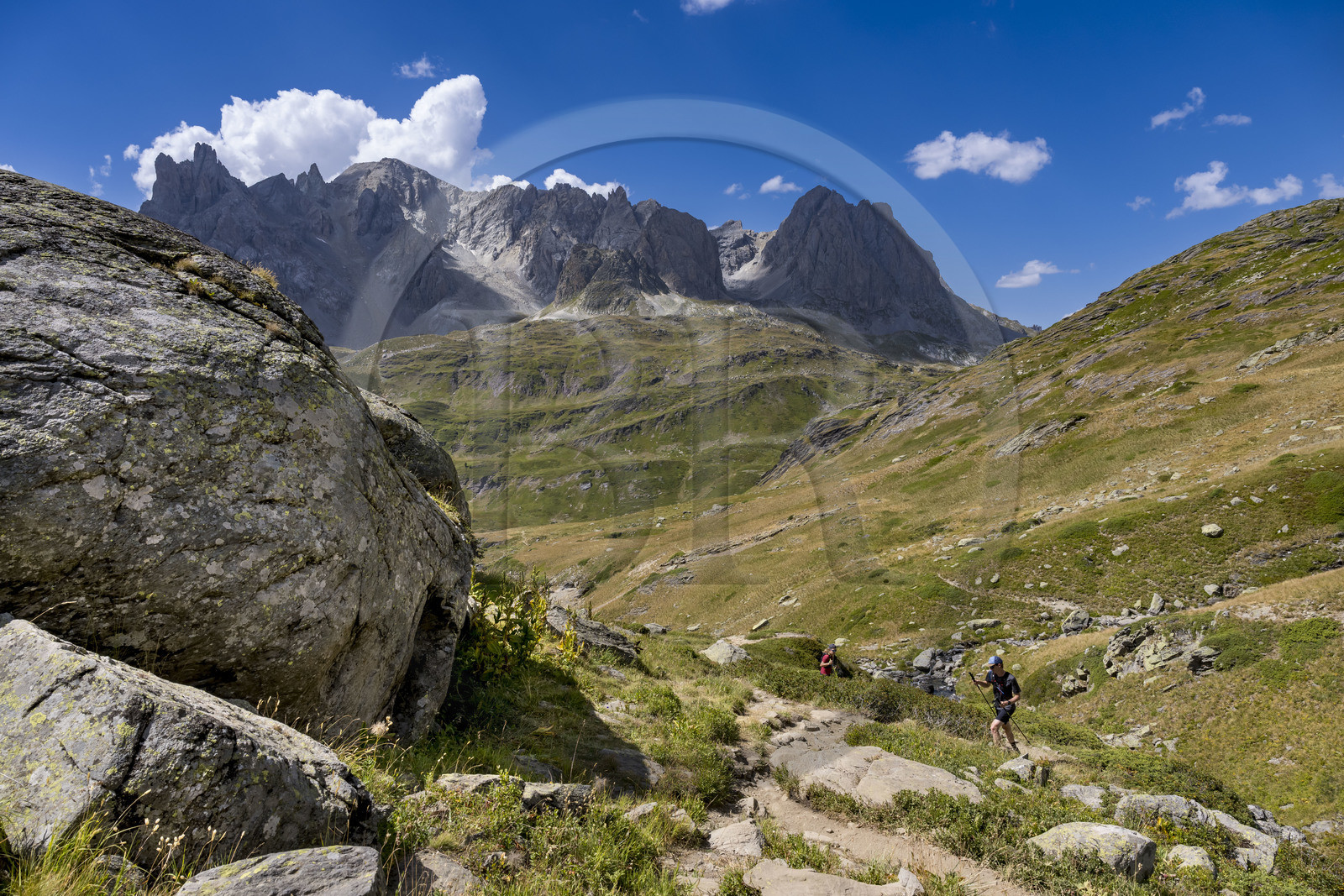 France, Hautes Alpes, Briancon region, Nevache, the upper Clarée valley, hikers in the upper Clarée valley, the Cerces massif in the background