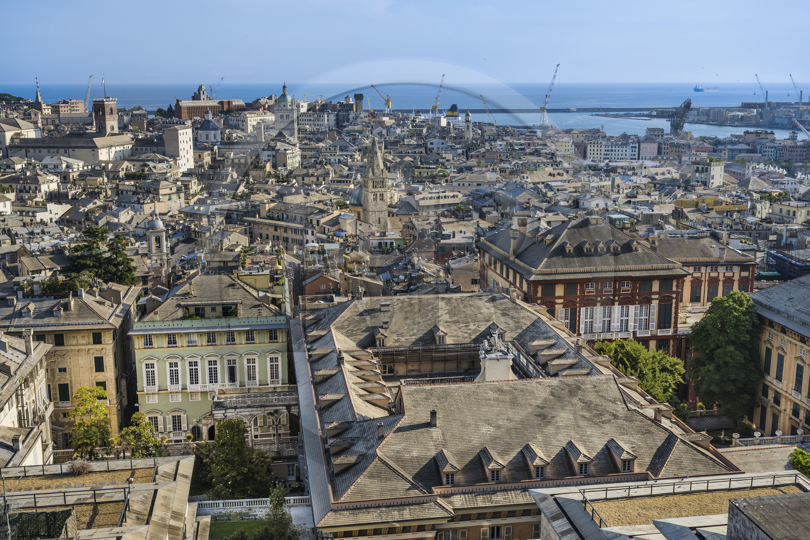 Italy, Liguria, Genoa, Rolli Palace listed as World Heritage by UNESCO in the Strada Nuova today via Garibaldi in the foreground, the Porto Antico (Old Port) and the commercial port in the background, seen from the Belvedere of Castelletto