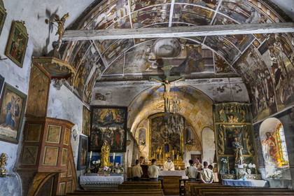 France, Hautes Alpes, Nevache, village of Plampinet, interior of the Saint Sebastien church, 16th century wall frescoes, Scouts of Europe, Saint Vincent de Paul clan, celebrate a mass