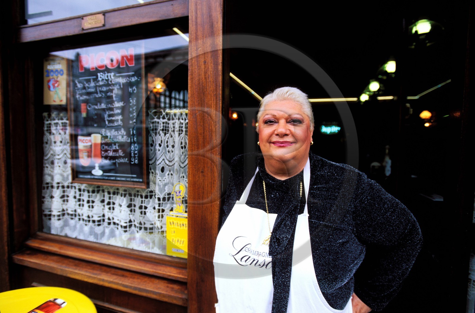 France, Nord, Lille, old town, Monique in front of her cafe the Tord-Boyaux