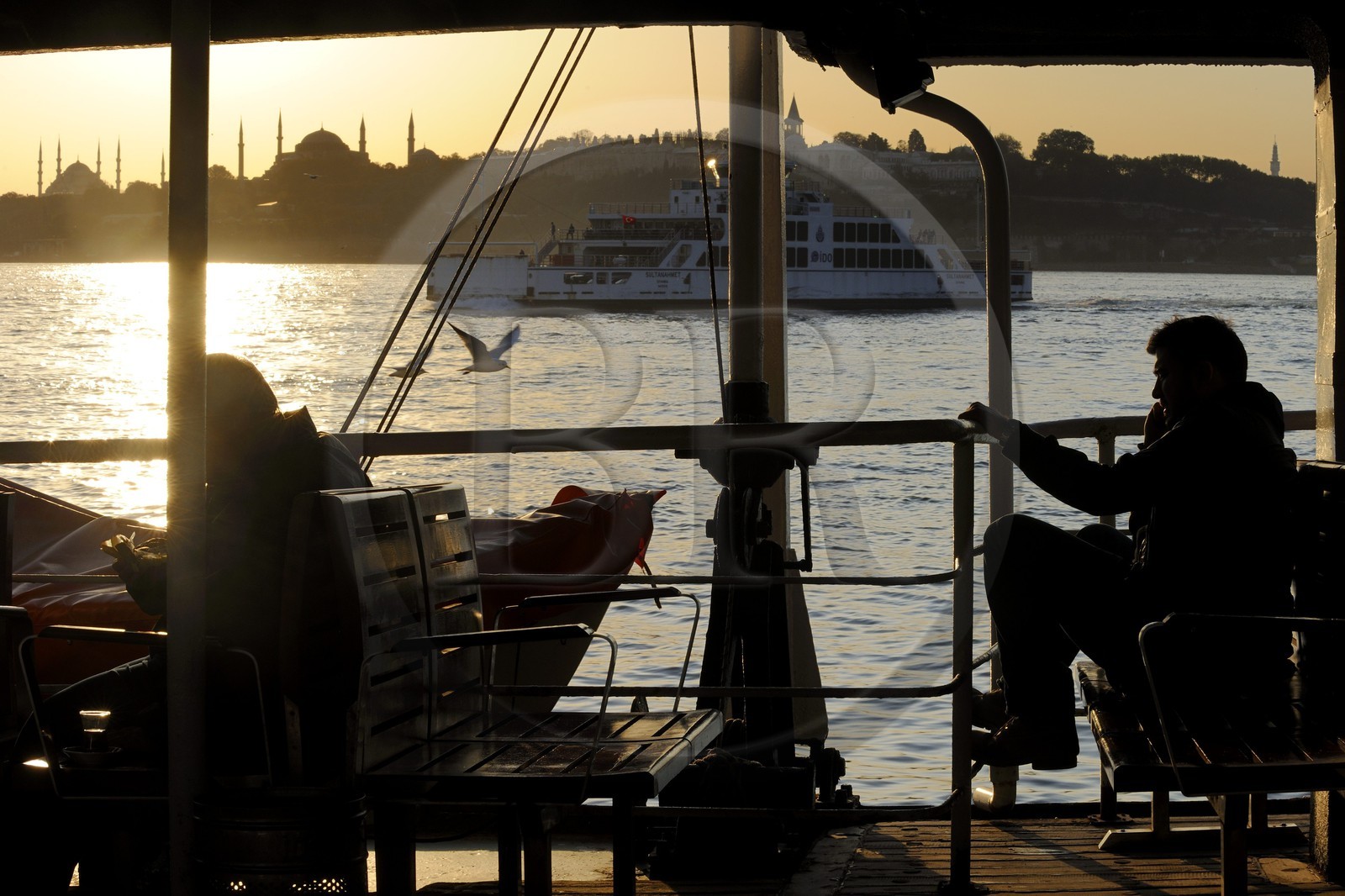 Turkey, Istanbul, ferry crossing the Bosphorus Strait, in the background Sultan Ahmet Camii Mosque (Blue Mosque), Hagia Sophia Basilica and Topkapi Palace in Sultanahmet District listed as World Heritage by UNESCO