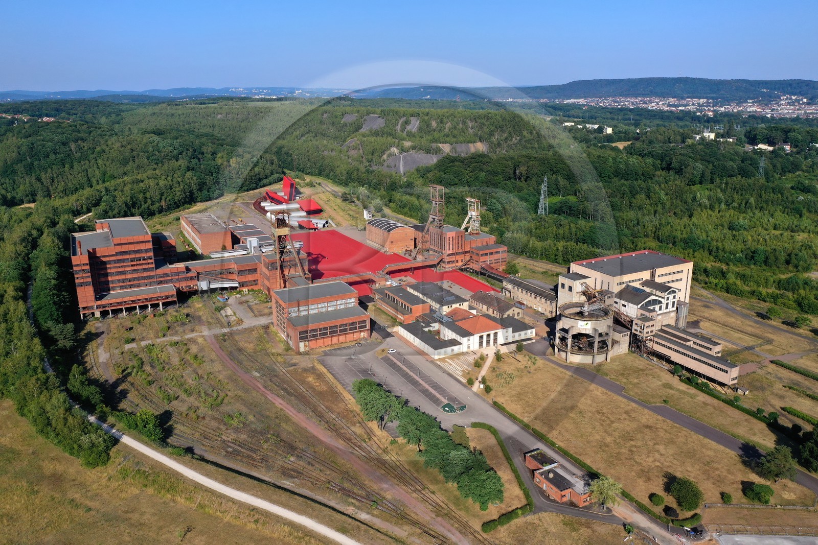 France, Moselle, Petite Rosselle, carreau Wendel museum, the Wendel site and its coal mine shafts, spoil heaps and the city of Forbach in the background (aerial view)