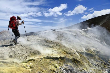 Italy, Sicily, Aeolian Islands, listed as World Heritage by UNESCO, Vulcano Island, hikers climbing the crater of volcano della Fossa through sulfur fumaroles