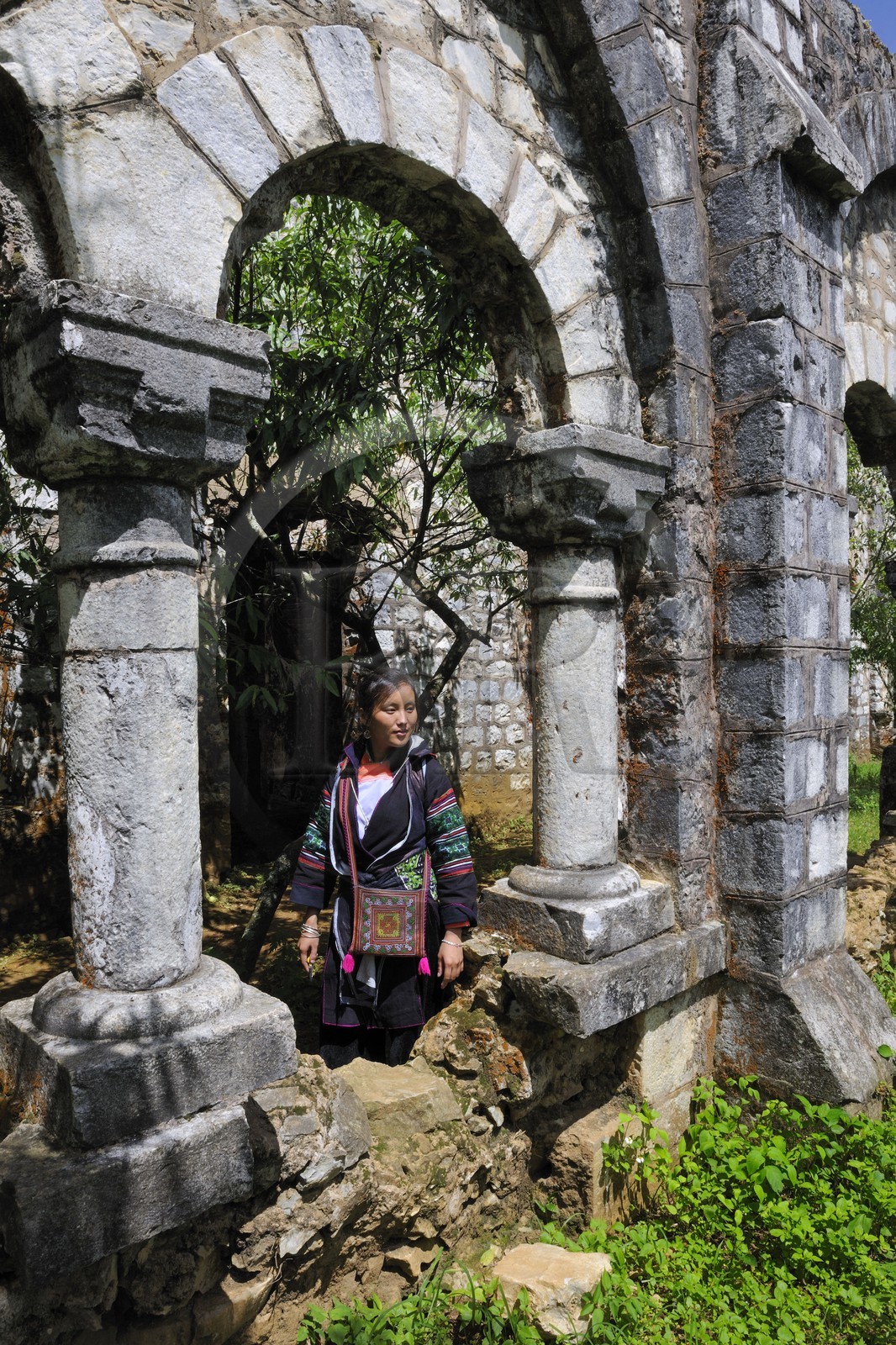 Vietnam, Lao Cai province, Sapa district, Ta Phin valley,  woman from the Black Hmong minority group in the Ta Phin monastery ruins