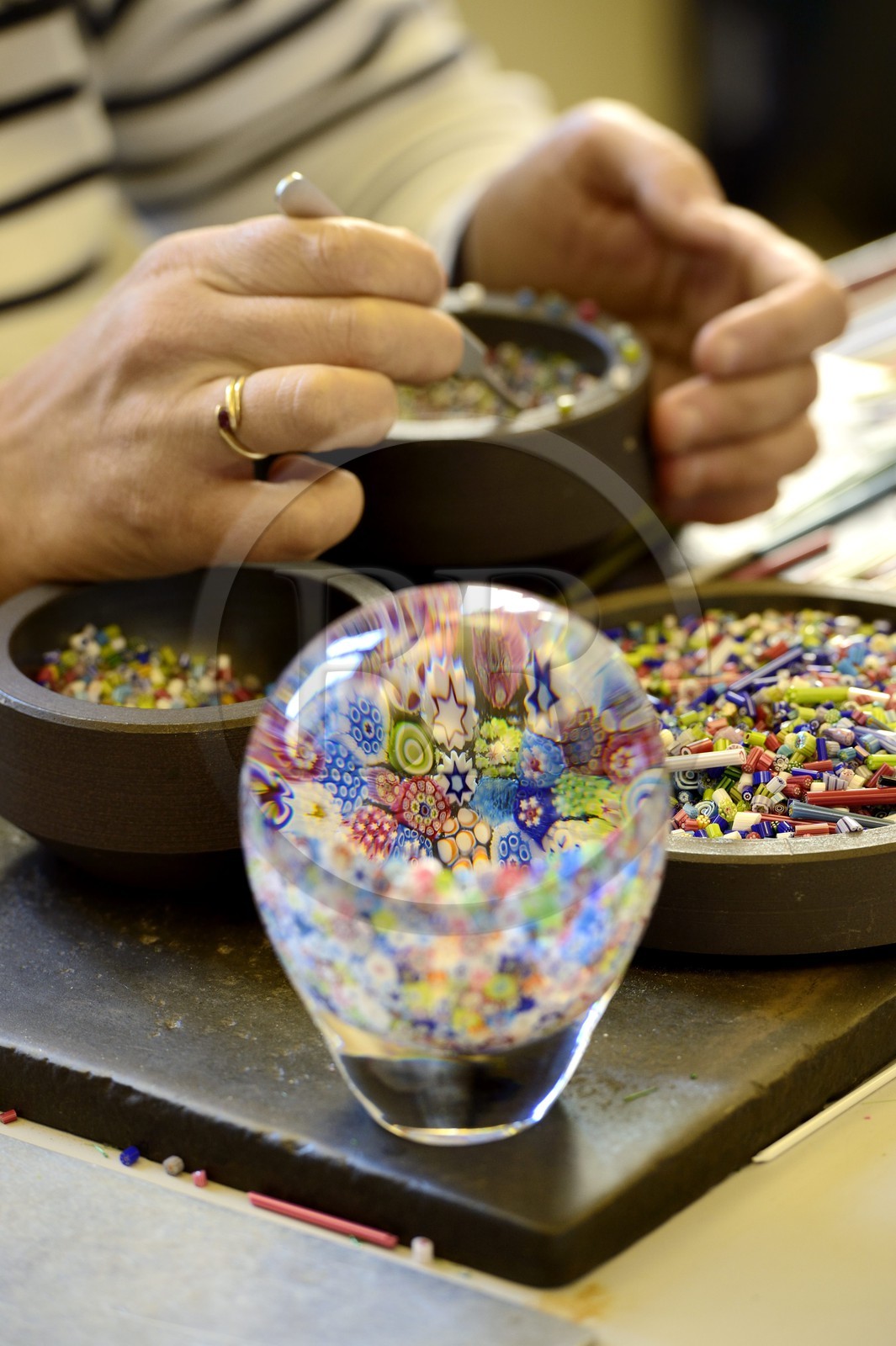 France, Moselle, Saint-Louis-les-Bitche, the Cristallerie Saint-Louis (Saint-Louis crystal glass manufacturer), preparation of a paperweight from crystal color chopsticks shaped by torch, tweezers and scissors