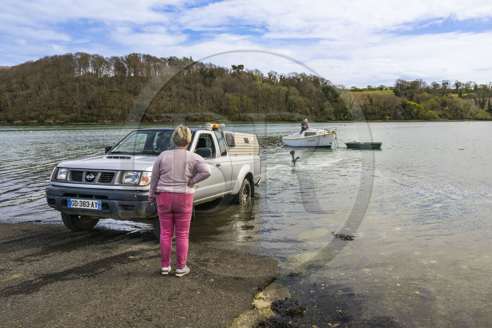France, Côtes-d'Armor, Tredarzec, retired fisherman Jean François Urvoy and his wife Nadine launch their boat for the summer season in the mouth of the Jaudy river