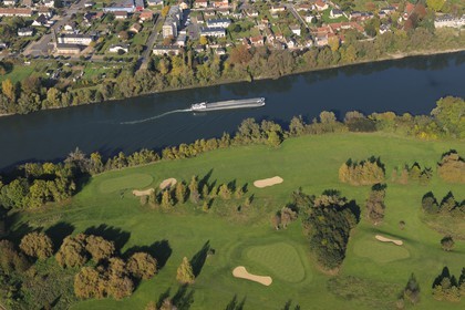 France, Seine-Maritime, golf course of Val-de-Reuil facing the town of Le Manoir (Pitres) and a barge on the Seine river (aerial view)