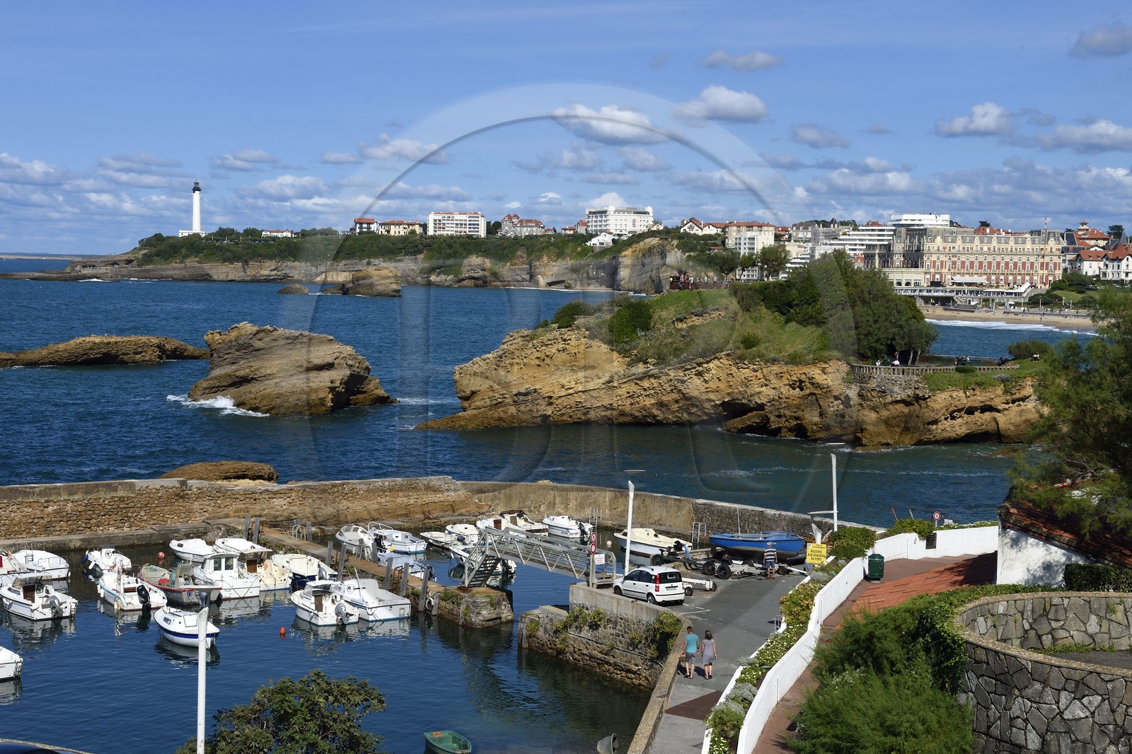 France, Pyrenees Atlantiques, Basque Country, Biarritz, Port des Pecheurs, the lighthouse and the Hotel du Palais located on Grande Plage (Great beach) in the background
