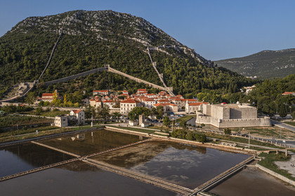 Croatia, Dalmatia, peninsula of Peljesac, the old town of Ston and the ancient salt marshes in the foreground (aerial view)