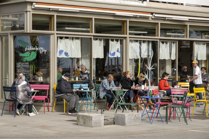 France, Loire-Atlantique, Saint-Nazaire, terrace of the café restaurant Sous les Palmiers place du Commando towards the Crab Claw