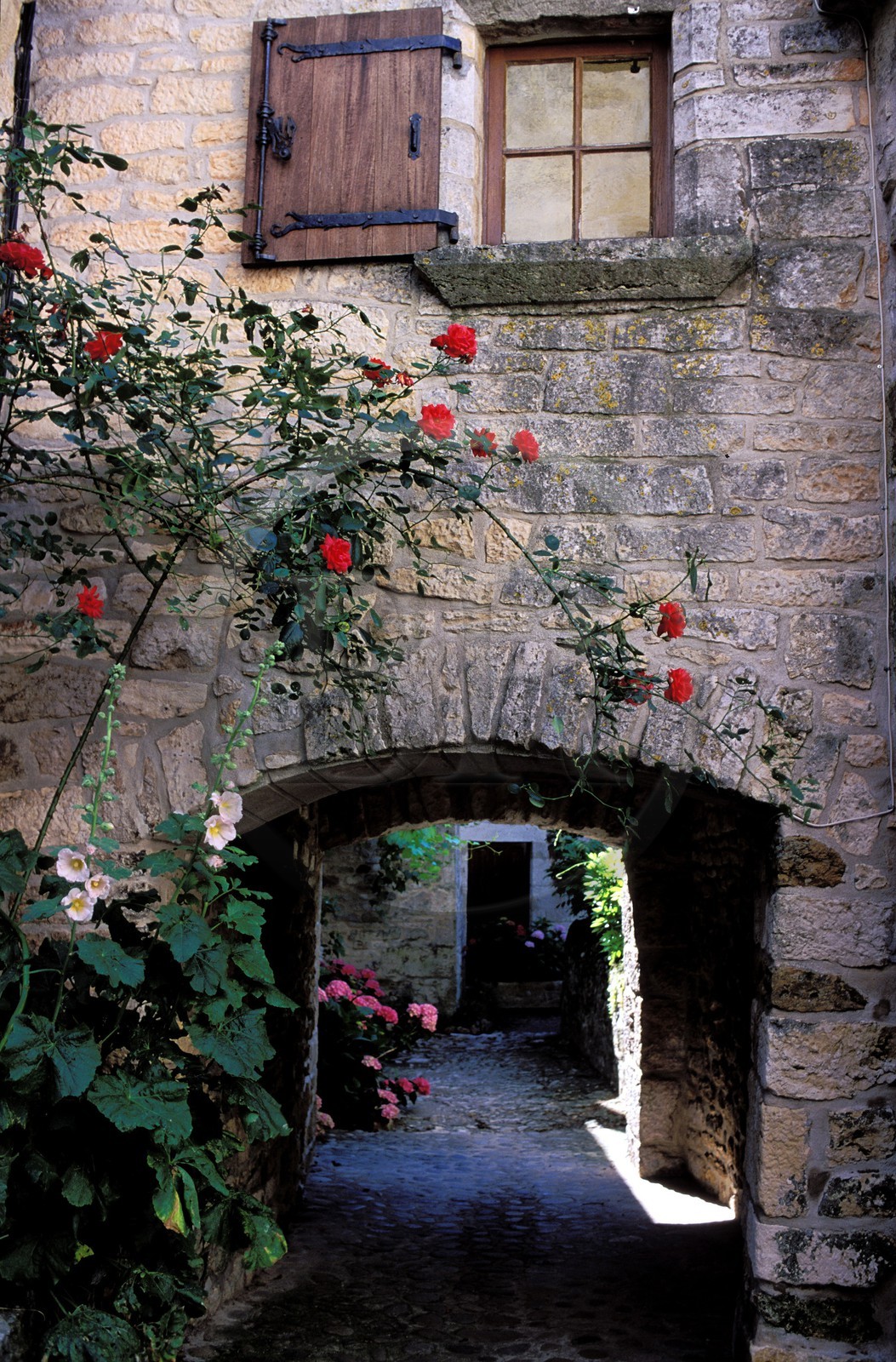 France, Correze, passage under a stone built house