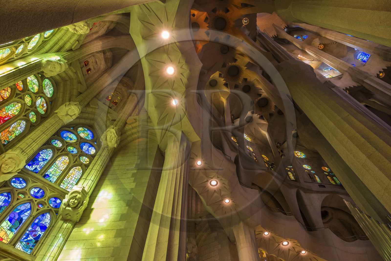 Spain, Catalonia, Barcelona, Eixample district, Sagrada Familia basilica by Catalan modernist architect Antoni Gaudi, listed as a UNESCO World Heritage Site, stained glass windows of the apse above the ambulatory by the Catalan painter and glassmaker Joan Vila-Grau