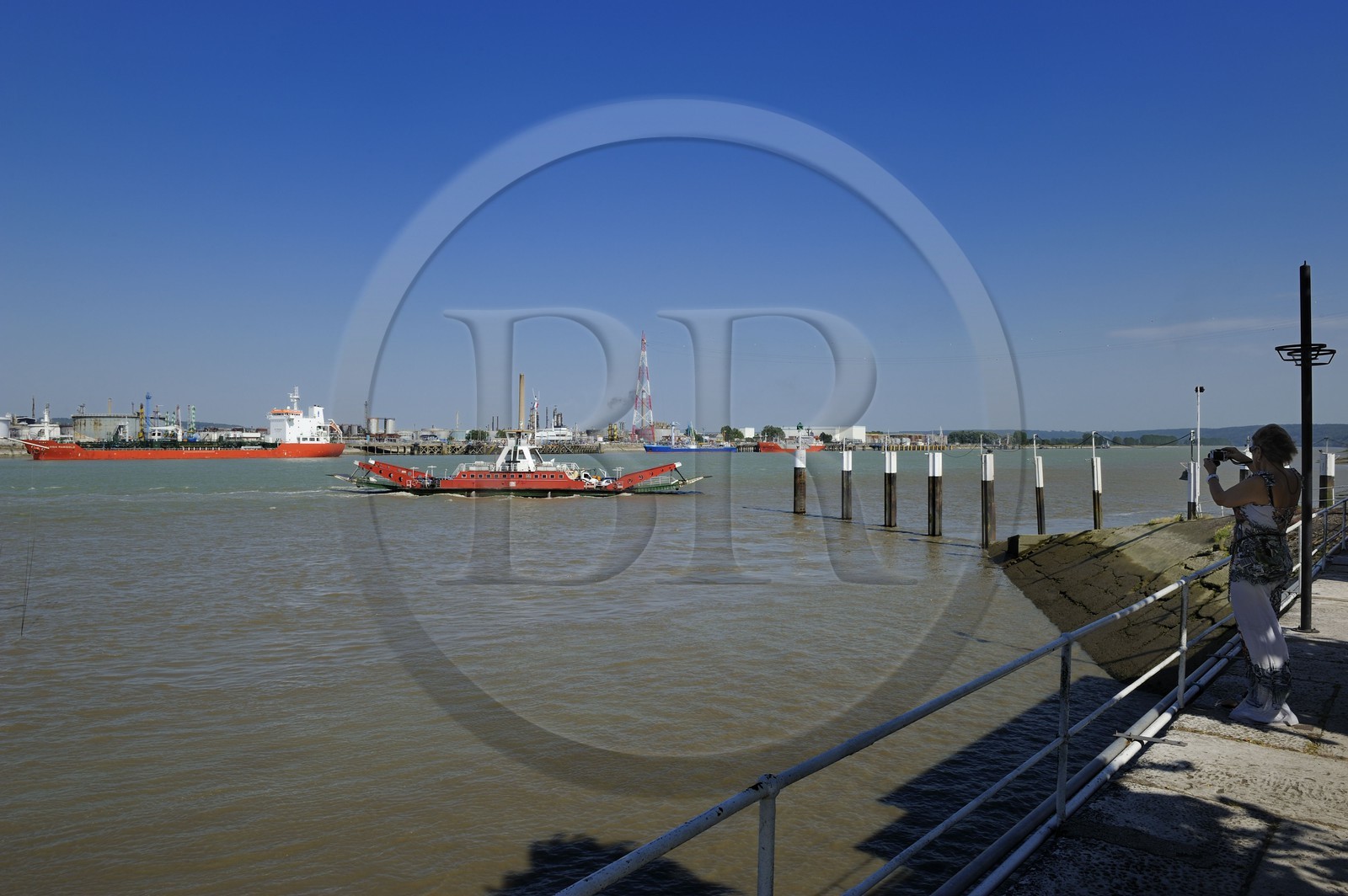 France, Seine-Maritime, Quillebeuf sur Seine in the Eure, ferry crossing the Seine and refinery of Port Jerome