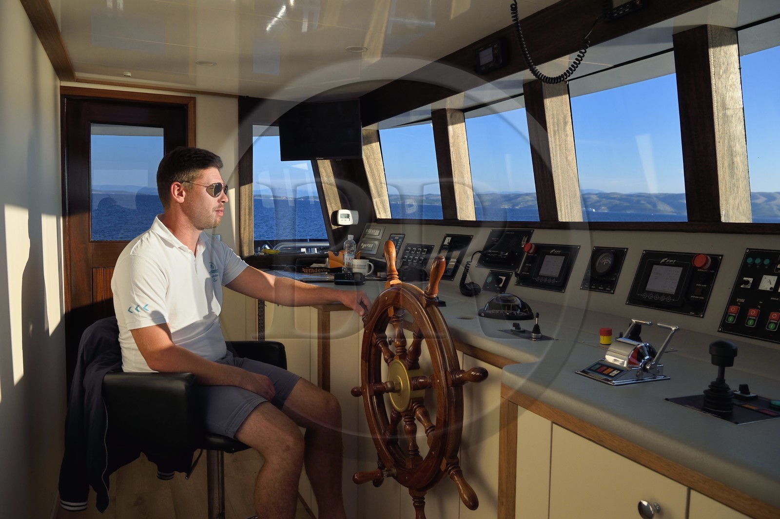 Croatia, Dalmatia, cruise ship Ave Maria and its captain Rade Naranca in the wheelhouse