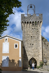 France, Drome, regional natural park of Baronnies provencales, Montbrun les Bains, labeled the Most Beautiful Villages of France, old gate of the ramparts at the entrance to the medieval village, the Belfry or clock tower