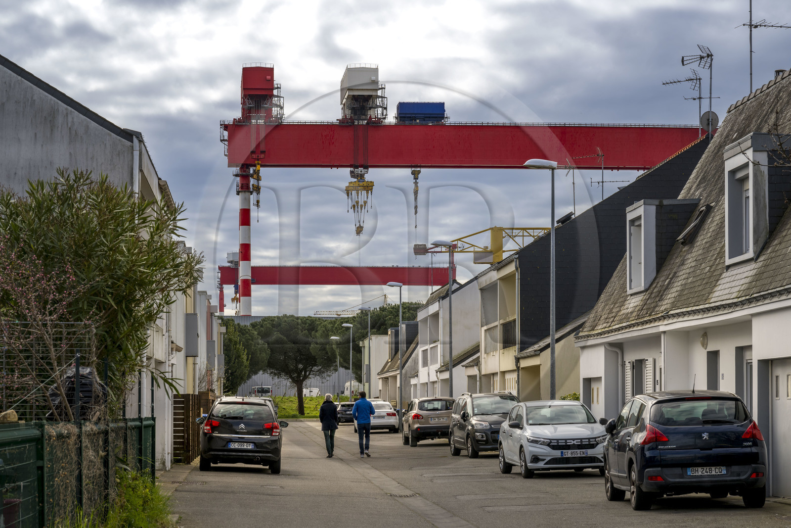 France, Loire-Atlantique, Saint-Nazaire, street in the Méan-Penhoët district overlooking the porticos of the Chantiers de l'Atlantique