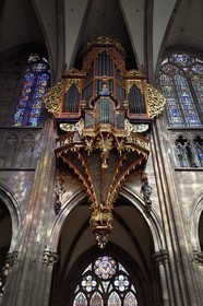 France, Bas Rhin, Strasbourg, old town listed as World Heritage by UNESCO, Notre Dame Cathedral, the great organ overlooking the nave, the automaton called the Rohraffe (also Bretzelmann) on the right under the great organ, from there the faithful and the clergy were insulted during the services of the festivals of Pentecost, on the left a herald brings a trumpet to his mouth with the help of cables drawn by the organist