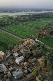 Egypt, Upper Egypt, Nile Valley, Luxor, a village of the West bank and the Nile in the background (aerial view)