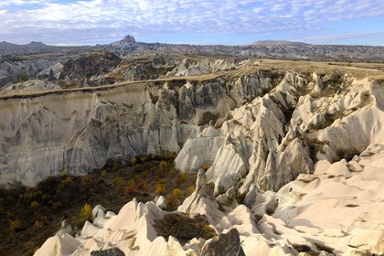 Turkey, Central Anatolia, Nevsehir Province, Cappadocia listed as World Heritage by UNESCO, Love Valley, erosion landscape and fairy chimneys with Uçhisar in the background (aerial view)