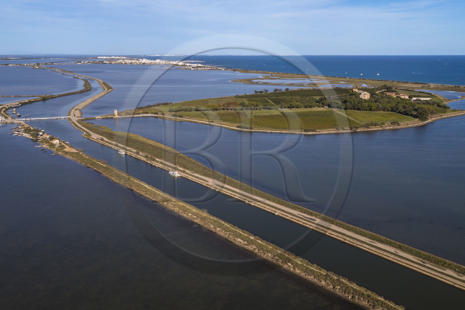 France, Herault, Villeneuve les Maguelone (Palavas Les Flots), Saint-Pierre-et-Saint-Paul de Maguelone cathedral from the 12th and 13th centuries on its island on the edge of the Rhone to Sète Canal (aerial view)