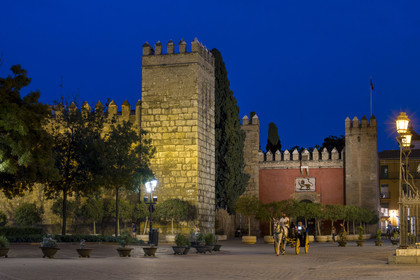 Spain, Andalusia, Seville, the Alcazar of Seville (Reales Alcazares de Sevilla), listed as World Heritage by UNESCO, the outer wall, carriage in front of the Lion Gate