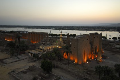 Egypt, Upper Egypt, Nile Valley, Luxor Temple at dusk, listed as World Heritage by UNESCO and the Nile