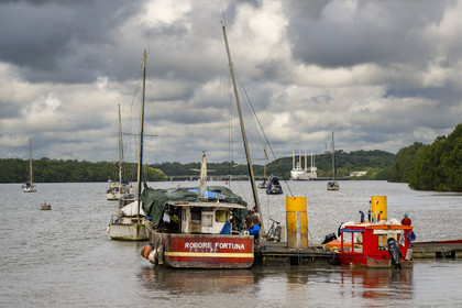 France, French Guiana, Kourou, The fishermen's jetty on the Kourou River near the Balourous maritime station, the Canopée docked at the port of Pariacabo in the background