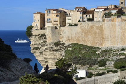 France, Corse du Sud, Bonifacio, the old town or Upper Town perched on limestone cliffs more than 60 meters high and connecting ferry to Sardinia