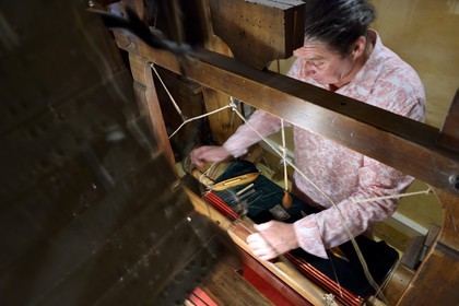 France, Rhone, Lyon, historical site listed as World Heritage by UNESCO, Vieux Lyon (Old Town), Saint George district, Ludovic de la Calle working on a Jacquard loom at the silk trade (Soierie) Saint-Georges