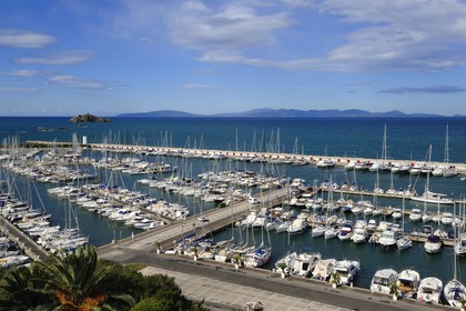 Italy, Tuscany, marina of Punta Ala and the Island of Elba in the background