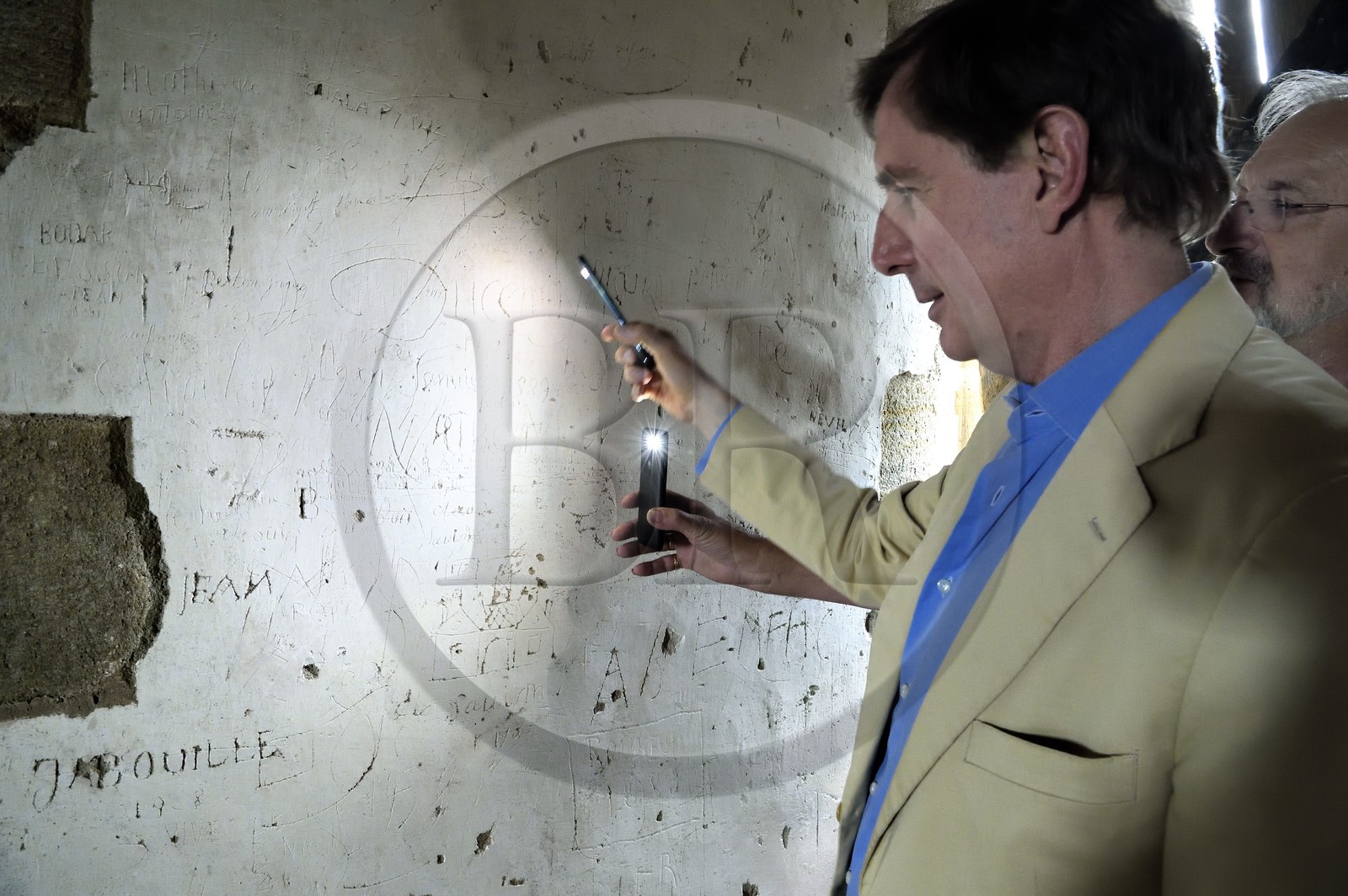 France, Allier (03), former province of Bourbonnais, Besson, Fourchaud castle (14th century to 16th century) now belonging to the descendants of the Bourbon-Parma, the Prince Charles Henri de Lobkowicz looking at graffiti on the second floor including that of Sieur Porcheron who represented the city of Angoulême and dated 1753