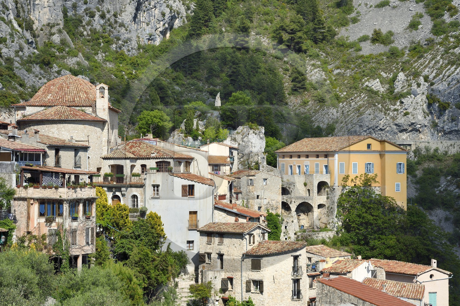 France, Alpes-Maritimes, the hilltop village of Peille, the Chapel of St. Sebastian (town hall), the War Memorial and the Palais Lascaris, right on the edge of the cliff