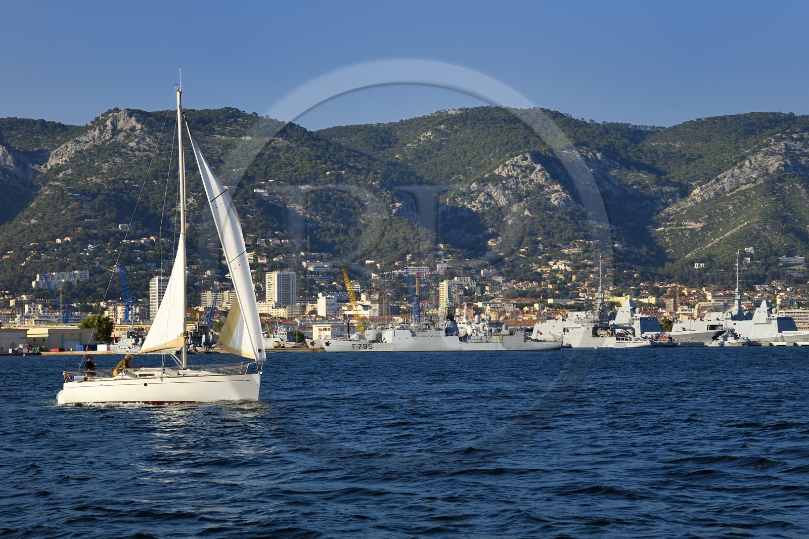 France, Var, Toulon, sailboat cruising off the naval base (Arsenal)