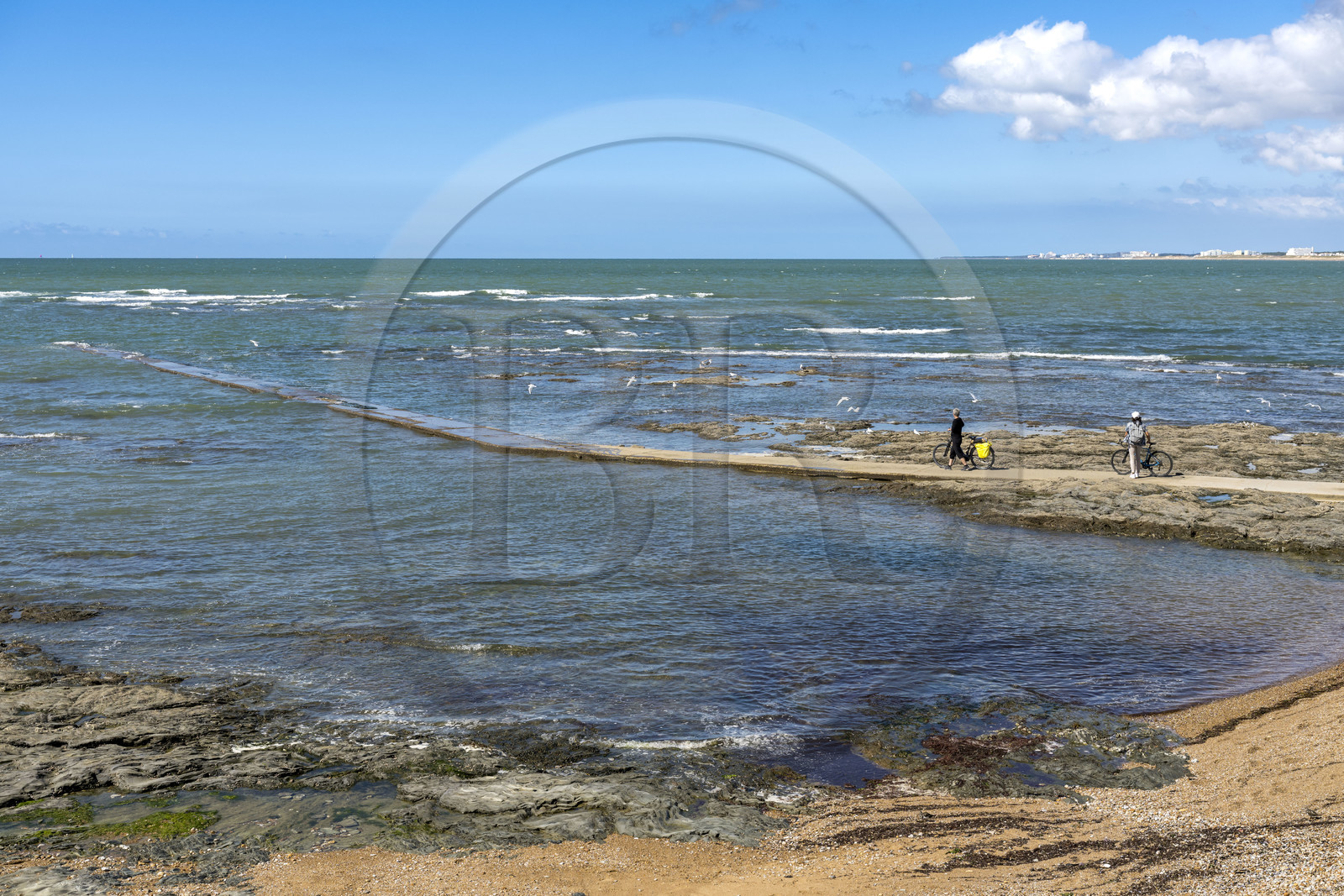 France, Vendée, Saint Hilaire de Riez, cyclists on a pier in Sion-sur-Mer located on the Cote de Lumière (aerial view)