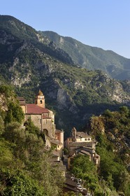 France, Alpes-Maritimes, Roya Valley (Nice hinterland), at the foot of the Mercantour National Park, perched village of Saorge, Saint-Sauveur (St. Saviour) church overlooks the valley