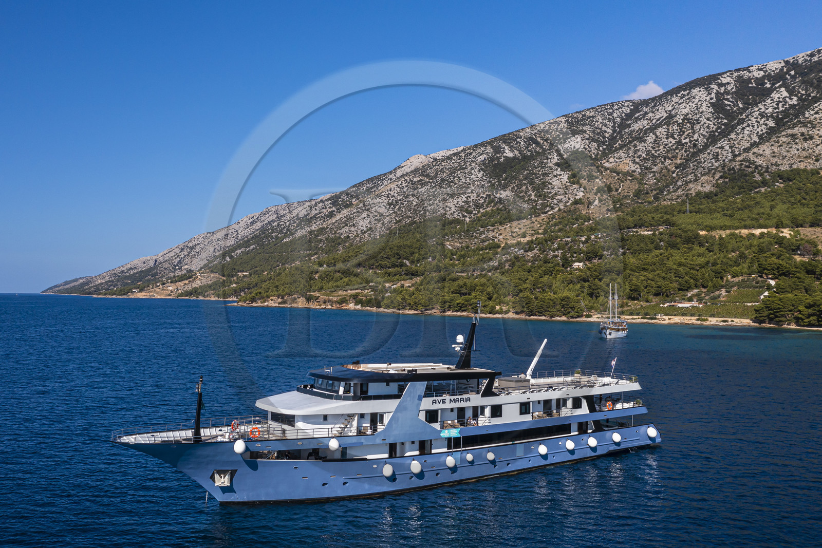 Croatia, Dalmatia, Dalmatian coast, Brac Island, Bol, the Ave Maria cruise ship along Zlatni Rat beach (aerial view)