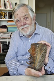 France, Paris, the french paleontologist and paleoanthropologist Yves Coppens, professor at the College de France, in the office of his home in Paris, it has a mammoth tooth he found in Siberia during one of his expeditions