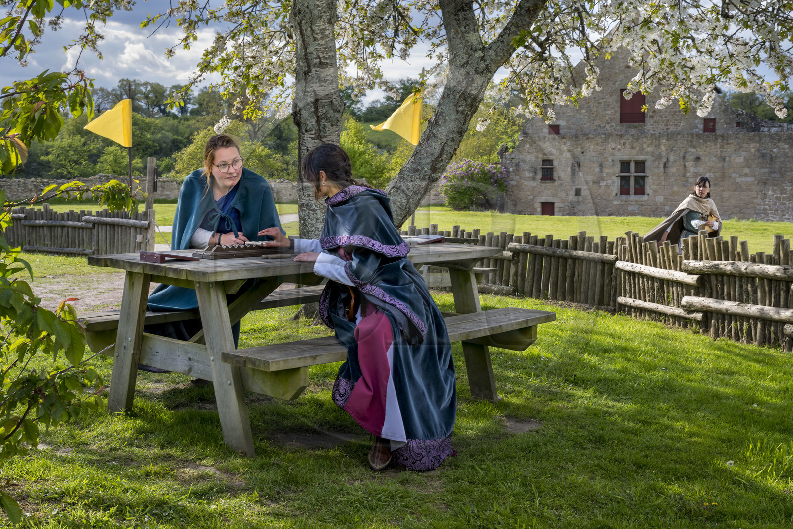 France, Vendee, Tiffauges, the castle of Tiffauges, women in medieval costumes in the old castle in ruins where Gilles de Rais resided