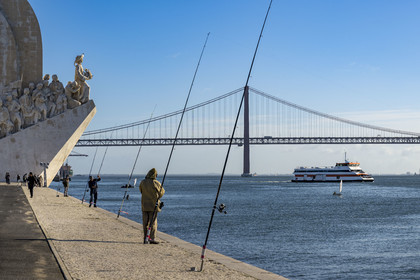 Portugal, Lisbon, Belem District, Padrao dos Descobrimentos (Monument to the Discoveries) dated 1960 and the 25 de Abril bridge on Tagus river